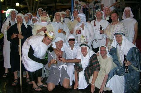 Stag group partying in costumes